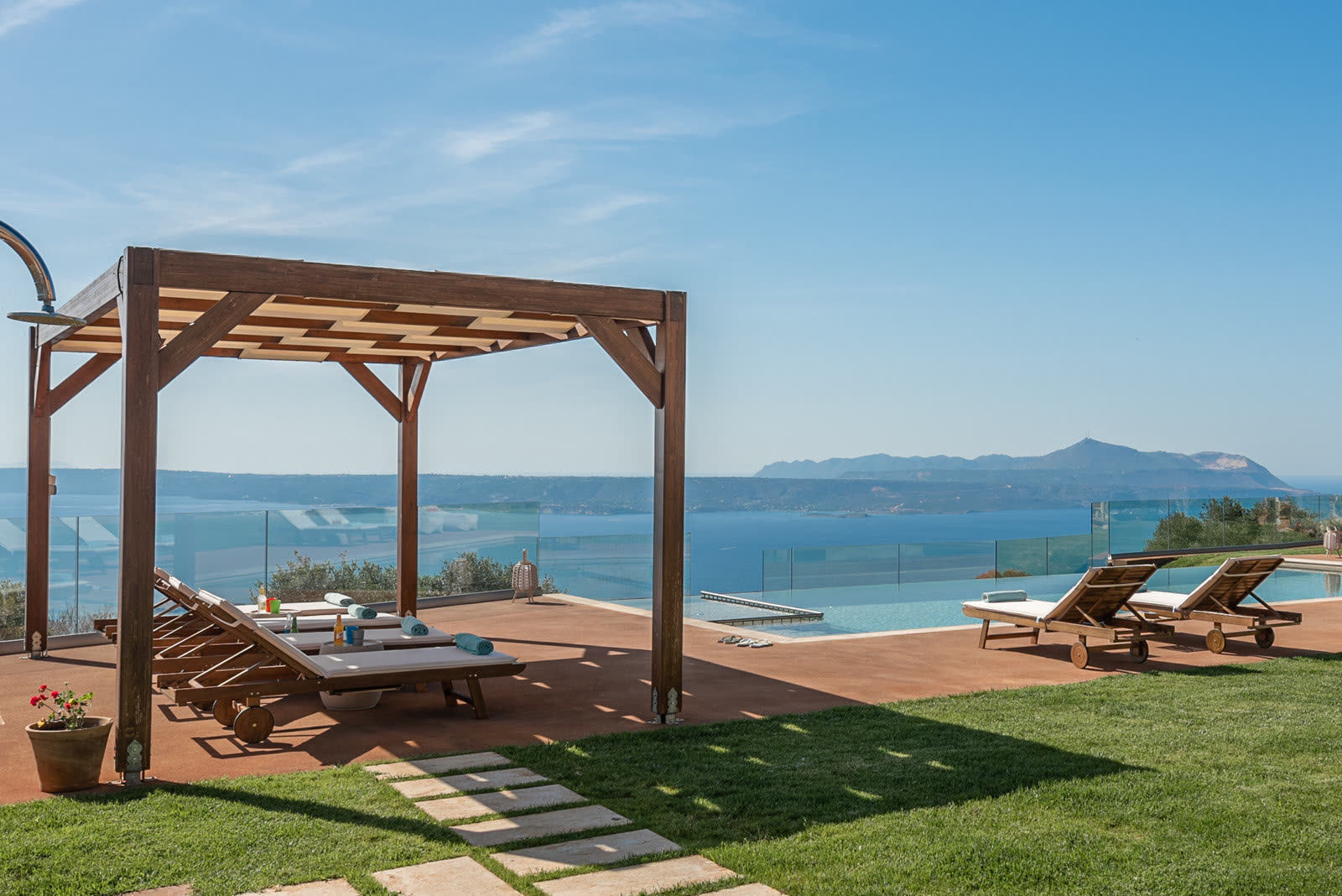 Infinity pool edge, pergola and panoramic sea view