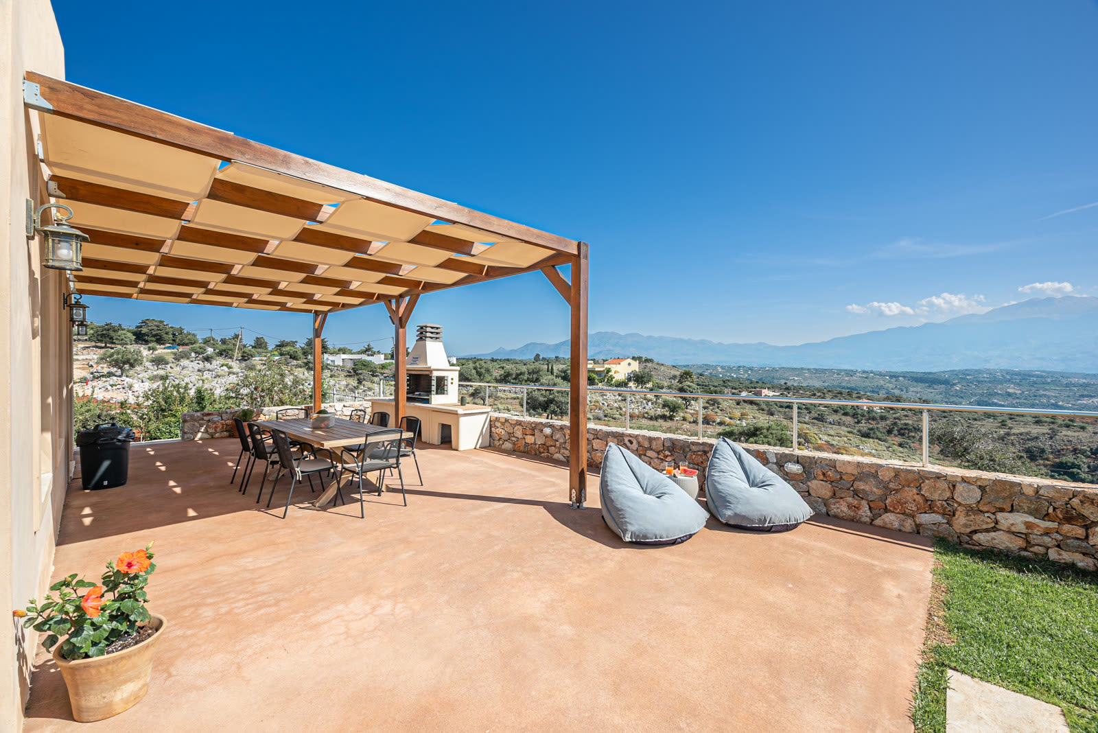Pergola dining terrace with built-in barbecue and countryside views